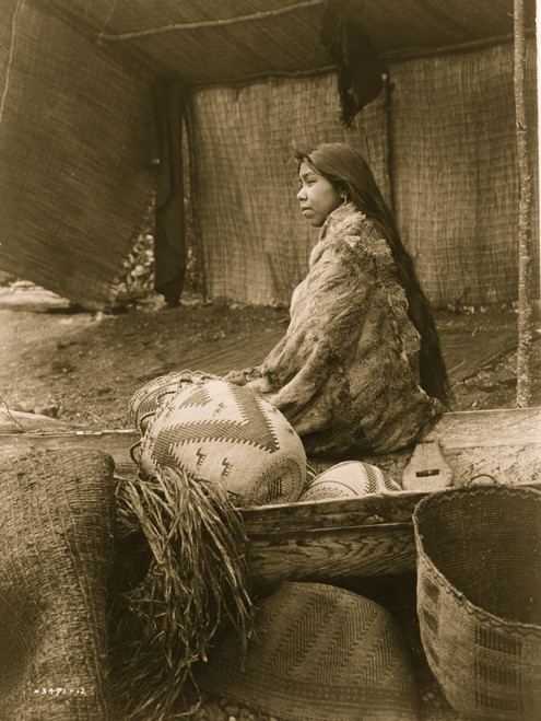 A Skokomish Indian chief's daughter, half-length portrait, seated on canoe, facing left Poster Print - Item # VARBLL058747561L