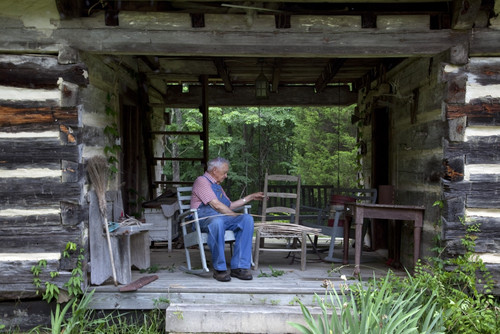 Basket weaver in Log Cabin Poster Print