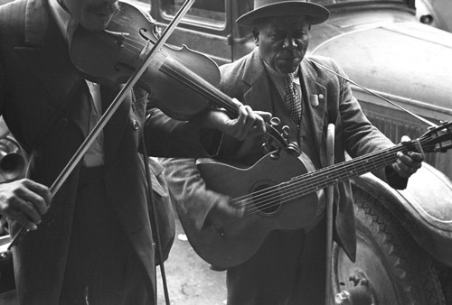 African American musicians play a violin  Guitar Poster Print - Item # VARBLL058744856L
