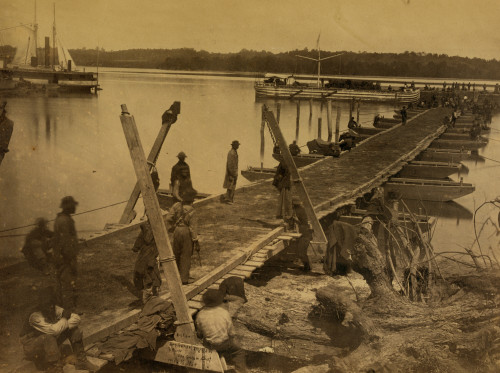 United States Military Railroad engineering corps at work on a pontoon bridge on the wharf in Belle Plain, Virginia. Poster Print - Item # VARBLL058745581L