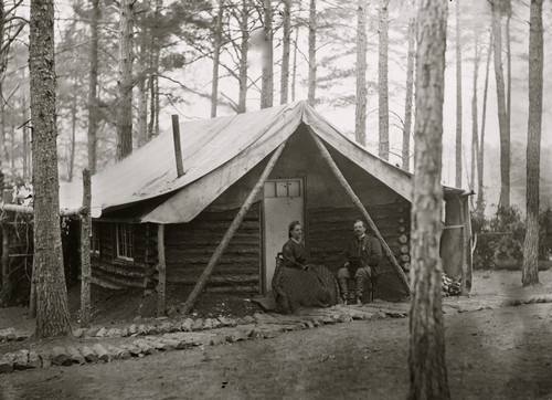 Brandy Station, Virginia. Col. John R. Coxe, A.C.S., and lady seated before his log-cabin winter quarters at Army of the Potomac headquarters Poster Print - Item # VARBLL058753674L