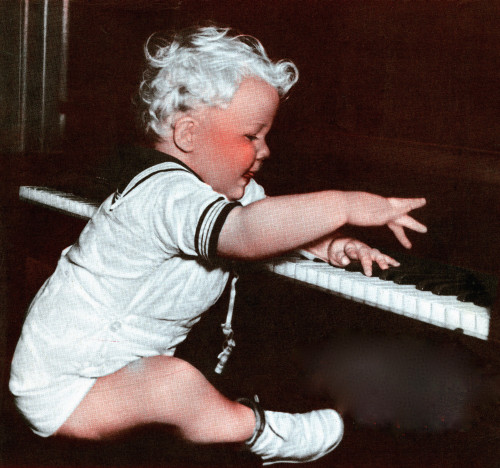 A Baby Plays a Piano Poster Print - Item # VARBLL0587435372