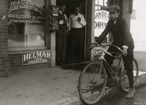 Fifteen year old delivery boy for Linders Drug Store, which is located on the edge of the Reservation, Griffin Street. The boy has just returned from a trip to these Houses. He works from 8 A.M. to 8 P.M. Poster Print - Item # VARBLL058754700L