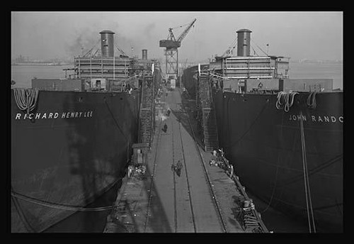 Liberty ships. This is the bow of a new Liberty Fleet member, awaiting its hose or template at a large Eastern shipyard. Bethlehem-Fairfield Shipyards Inc., Baltimore, Maryland Poster Print by Alfred T. Palmer - Item # VARBLL058720379x