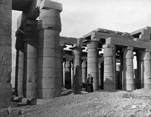Man standing in rubble amidst temple columns in Egypt.  The Memnonium.  Luxor is a city in Upper Egypt and the capital of Luxor Governorate and the site of the Ancient Egyptian city of Thebes Poster Print by Francis Firth - Item # VARBLL0587419482