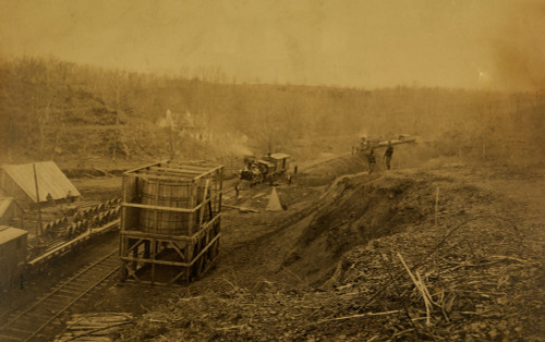 Two locomotives pulling into the Union Mills Station on the Orange and Alexandria Railroad in Clifton, Virginia. Two soldiers stand guard on the bank at right. Poster Print - Item # VARBLL058745580L
