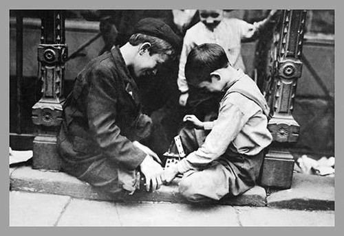 Immigrant children enjoying the activity of building a house from playing cards. Poster Print by unknown - Item # VARBLL0587025654