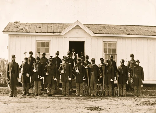 Arlington, Va. Band of 107th U.S. Colored Infantry at Fort Corcoran; group of twenty African American soldiers with musical instruments. Poster Print - Item # VARBLL058752210L