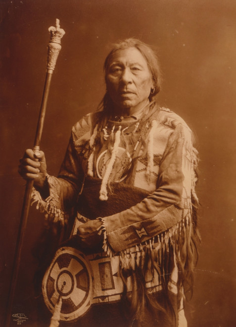 Running Rabbit, Native man, half-length portrait, standing, facing front, holding staff. Poster Print - Item # VARBLL058747074L