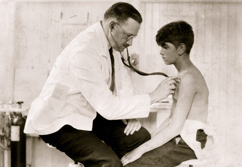 Doctor Examines a Boys Bare chest with his stethoscope Poster Print - Item # VARBLL058754230L