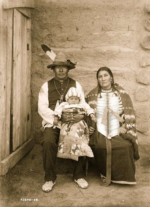 Indian family: woman and man in native dress holding baby. Poster Print - Item # VARBLL058747450L