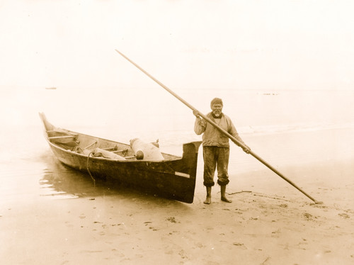 Light House Joe, an old Makah Indian, holding a pole, by boat, on beach, at Neah Bay, Washington Poster Print - Item # VARBLL058751256L