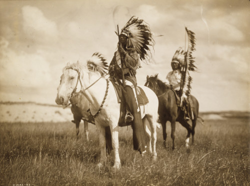 Two Sioux Chiefs in full Regalia on Horseback Poster Print - Item # VARBLL058746936L