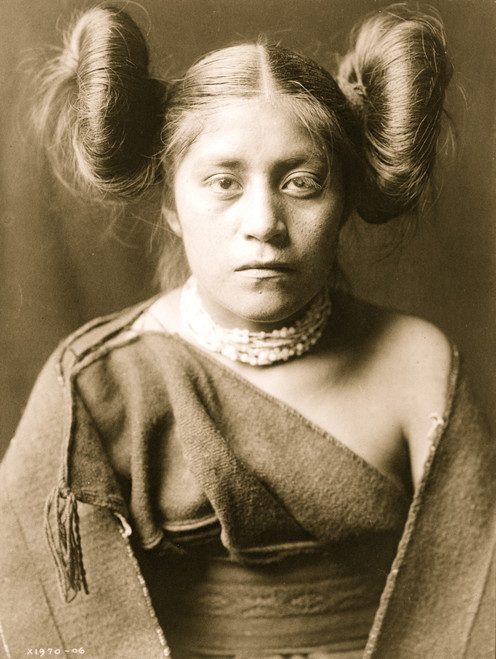 A Tewa girl, half-length portrait, facing front, hair arranged in "squash blossom" fashion. Poster Print