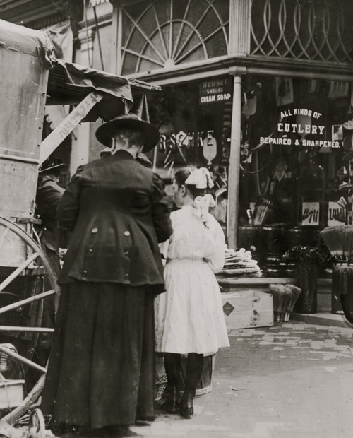 Young vendor sells goods outside of a cutlery store Poster Print - Item # VARBLL058754745L