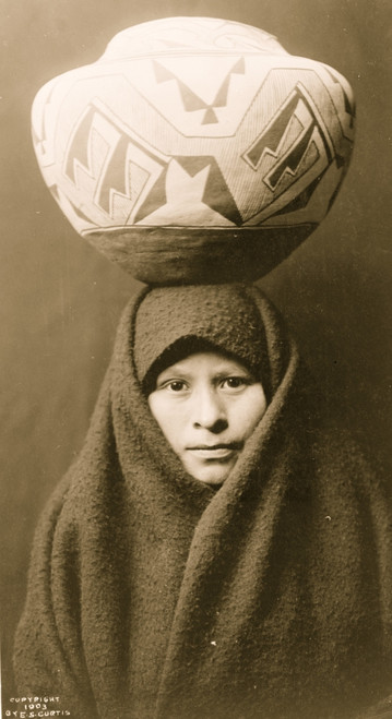 Head-and-shoulders portrait of Zuni girl with pottery jar on her head. Poster Print - Item # VARBLL058746891L