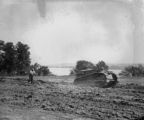 Old Plow Pulled by Tank Like Tractor Poster Print