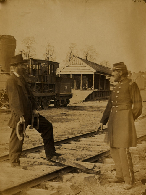 Military railroad operations in northern Virginia: soldier and another man standing at railroad tracks in front of locomotive Poster Print - Item # VARBLL058745599L
