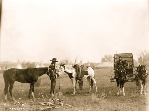 High Medicine Rock, Crow Indian with two horses at left, Her Horse Kills with child in buggy at right, tepees and circus type tent in background, Montana Poster Print - Item # VARBLL058746871L