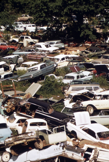 An Automobile Junkyard. Wrecked Car Parts Were Sold For Auto Repairs And Whole Cars For Recycling As Scrap Steel. Ca. 1973-75. History - Item # VAREVCHISL031EC197