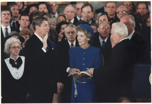 President Reagan Was Sworn In On Inaugural Day Inside The U.S. Capitol Because Of Dangerously Cold Weather. Chief Justice Warren Berger Leads The Ceremony As Nancy Reagan Holds The Bible. Jan. 21 1985. History - Item # VAREVCHISL023EC115 President Reagan Was Sworn In On Inaugural Day Inside The U.S. Capitol Because Of Dangerously Cold Weather. Chief Justice Warren Berger Leads The Ceremony As Nancy Reagan Holds The Bible. Jan. 21 1985. History - Item # VAREVCHISL023EC115