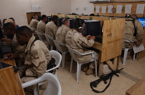 Us Army Soldiers E-Mail Their Families Before Eating Thanksgiving Dinner At Camp Cobra In Iraq On Nov. 25 2004. History - Item # VAREVCHISL028EC014