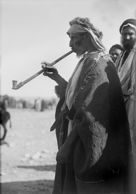 Bedouin Man Smoking A Long Pipe. History - Item # VAREVCHCDLCGCEC072