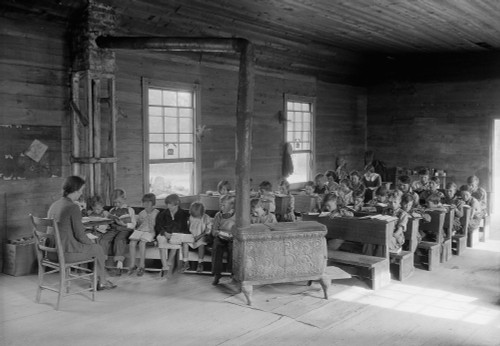 One Room School With 28 Students Of Various Ages. Bare Room Lacks Educational Equipment And Is Heated By A Wood Stove. Oakdale School Near Loyston History - Item # VAREVCHISL039EC434