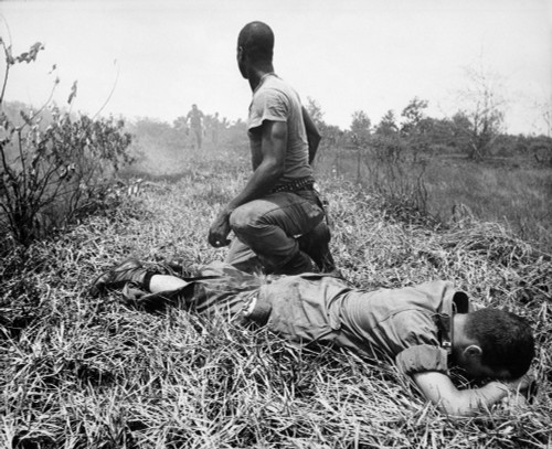Vietnam War. An African American Infantry Medic Treats A Lieutenant'S Leg History - Item # VAREVCHISL033EC583
