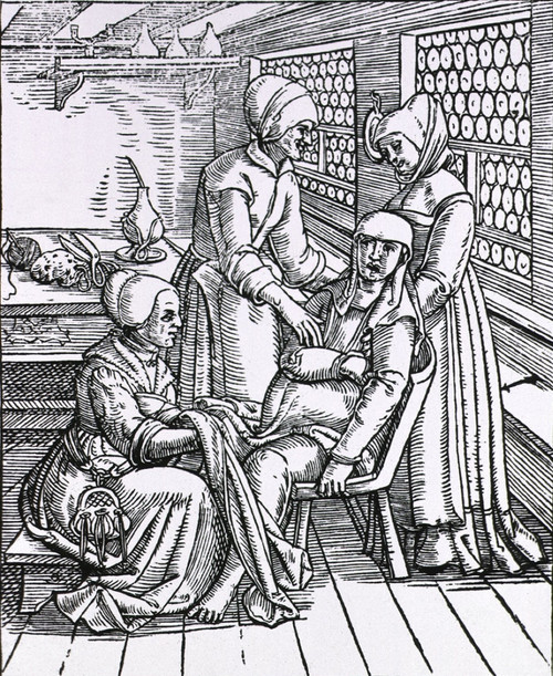 A Pregnant Woman Sitting In A Birthing Chair Is Being Attended To By Three Midwives History - Item # VAREVCHISL015EC070