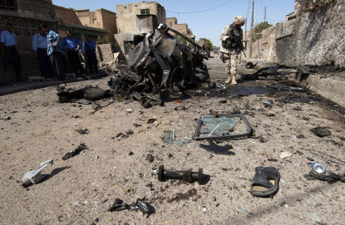 Us Soldier Inspects The Area Around A Suicide Bomber'S Vehicle In Tuz Iraq. The Bomber Killed Himself Injured Four Civilians And Three Iraqi Police Officers. June 17 2005. History - Item # VAREVCHISL027EC153 Us Soldier Inspects The Area Around A Suicide Bomber'S Vehicle In Tuz Iraq. The Bomber Killed Himself Injured Four Civilians And Three Iraqi Police Officers. June 17 2005. History - Item # VAREVCHISL027EC153