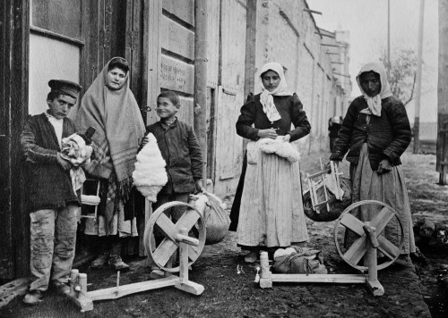 Armenian Women And Boys With Spinning Wheels And Cotton. Ca. 1915-21. This Is Possibly A Refugee Family Receiving Tools To Make A Living In Yerevan History - Item # VAREVCHISL035EC277