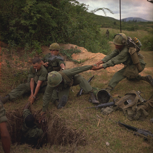 Vietnam War. A Us Infantryman Is Lowered Into A Tunnel By Members Of The Reconnaissance Platoon During Operation Oregon. They Are On A Search And Destroy Mission In Quang Ngai Province. April 24 History - Item # VAREVCHISL033EC542