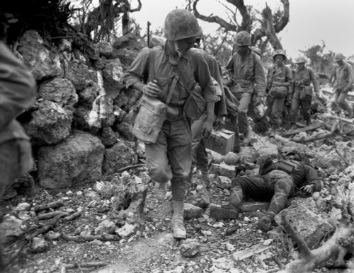 U.S. Marines Pass Through A Small Village Where Japanese Soldiers Lay Dead. Okinawa History - Item # VAREVCHISL036EC765