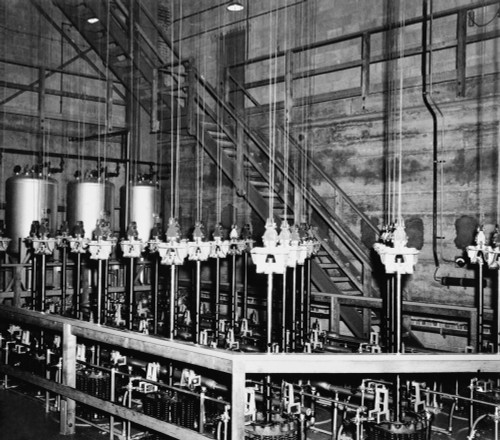 The Vertical Safety Rods And The Cables That Support Them At The Top Of The Atomic Pile Of A Reactor At The Manhattan Project Hanford Site. The Four Silvered-Colored Drums In The Background Contained Boron Solution History - Item # VAREVCHISL020EC007
