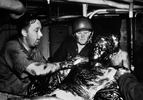 Coast Guardsmen Scrape A Thick Coating Of Oil From The Body Of U.S. Navy Seaman. His Ship Uss Lansdale History - Item # VAREVCHISL036EC956