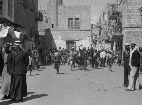 Arab Youths Running In Bethlehem After Burning Government Offices During Arab Revolt. Sept. 14 History - Item # VAREVCHISL044EC228 Arab Youths Running In Bethlehem After Burning Government Offices During Arab Revolt. Sept. 14 History - Item # VAREVCHISL044EC228