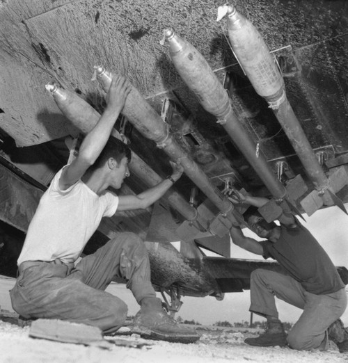 U.S. Marines Load Five-Inch Rockets Under The Wing Of A Corsair Fighter During Battle Of Okinawa. Photo By Lt. David Douglas Duncan History - Item # VAREVCHISL037EC853