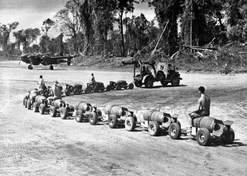 Three U.S. Marines Ride On A Truck Drawn Bomb Train At A Pacific Air Base. 1944. World War 2. History - Item # VAREVCHISL037EC852