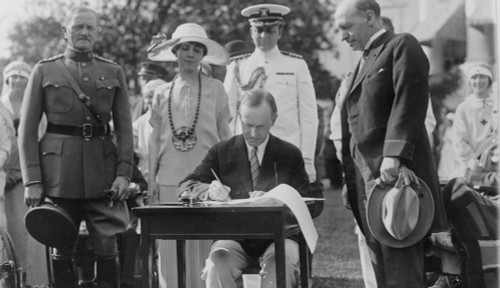 President Calvin Coolidge Signing Appropriation Bills For The Veterans Bureau On The South Lawn During The Garden Party For Wounded Veterans In 1924. Mrs. Coolidge And General John Pershing Look On. History - Item # VAREVCHISL002EC006
