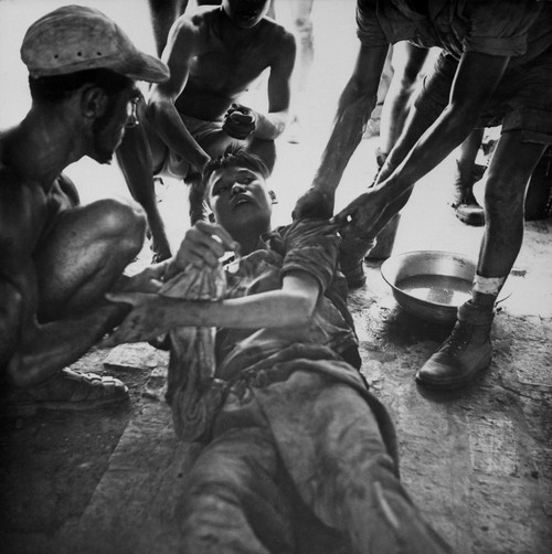 Vietminh Pow. A Wounded Vietminh Prisoner Is Given First Aid By Franco Vietnamese Medicals After Hot Fire Fight Near Hung Yen History - Item # VAREVCHISL033EC305