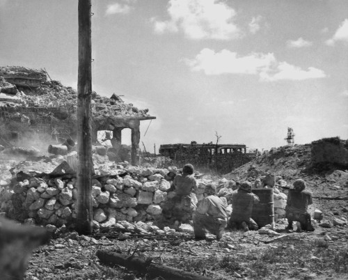 Marines Of The First Division Fire On Japanese Snipers In A Building On Peleliu Island. Sept.-Nov. 1944. World War 2 History - Item # VAREVCHISL036EC700