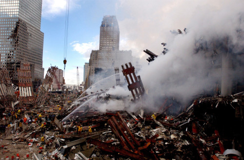 Firefighters Douse The Still Burning Pile Of Ruins Of The World Trade Center Two Days After The 911 Terrorists Attacks. Sept. 14 2001. History - Item # VAREVCHISL024EC149