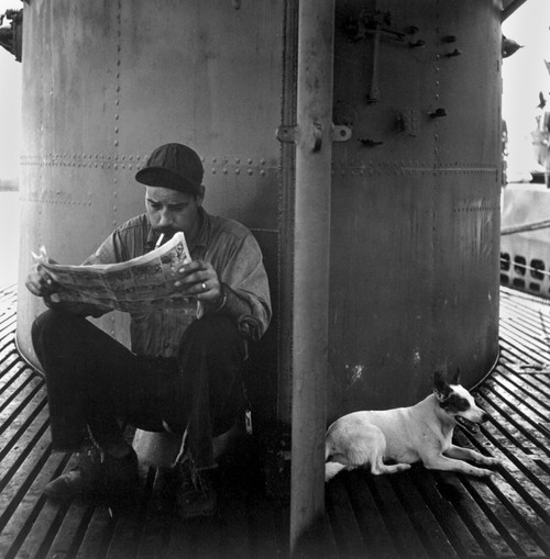 U.S. Submariner Reading His Favorite Comic-Strip. The Submarine Mascot Rests In The Shade Of The Conning Tower. During World War 2 History - Item # VAREVCHISL036EC267