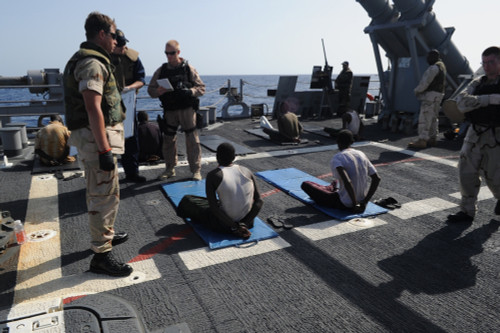 U.S. Sailors Guard Suspected Pirates On The Flight Deck Of The Guided Missile Cruiser Uss Gettysburg In The Gulf Of Aden April 17 2009. History - Item # VAREVCHISL024EC246
