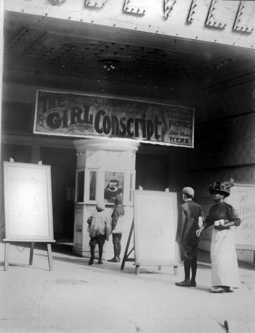 People In Front Of A Movie Theater Showing The Girl Conscript History - Item # VAREVCHCDLCGAEC311