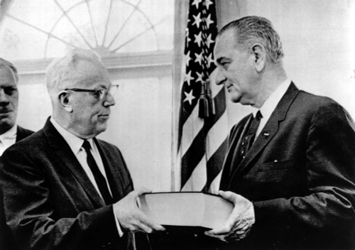 Gerald Ford Looks On As Chief Justice Earl Warren Presents President Lyndon Johnson With The Final Warren Commission Report On The Assasination Of President John F. Kennedy History - Item # VAREVCSBDWACOCS003