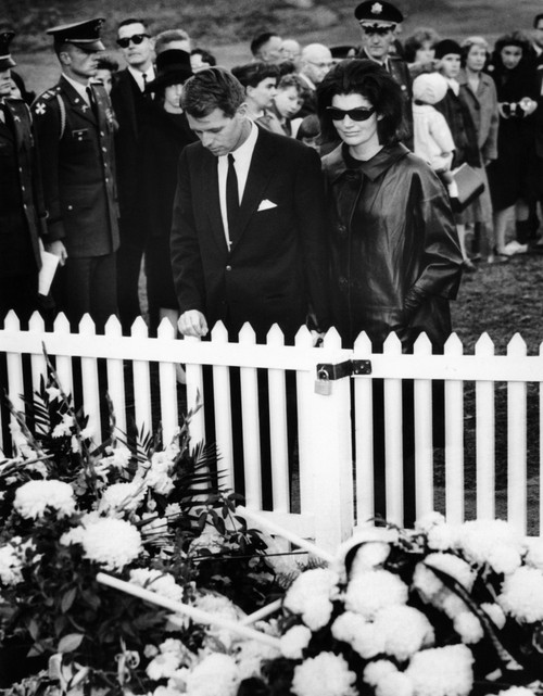 Jacqueline Kennedy And Attorney General Robert Kennedy Visit The Flower Covered Grave Of President John Kennedy At Arlington National Cemetery. Nov. 27 History - Item # VAREVCCSUA001CS158