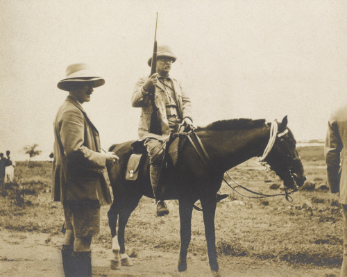 Theodore Roosevelt On Horseback And Holding A Rifle During His Safari. Standing By Him Is His Son Kermit History - Item # VAREVCHISL045EC206
