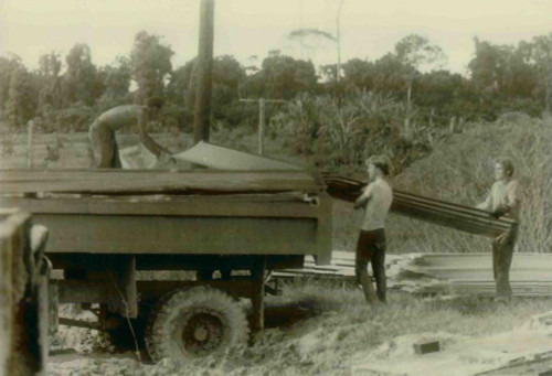 Construction Workers And Bobby Stroud And Others Unloading A Truck. People'S Temple Agricultural Project. Jonestown History - Item # VAREVCHISL034EC374
